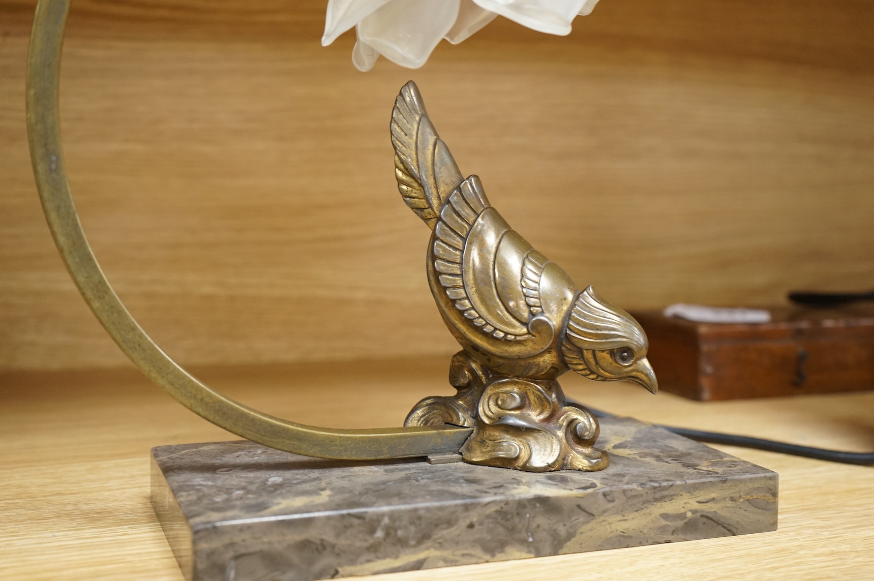 An Art Deco table lamp in the form of a bird with tchecoslovaquie glass shade, 26cm high
